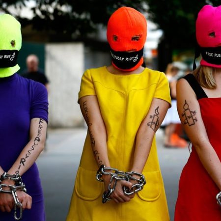 Demonstration to support Russian music group Pussy Riot...epa03362997 Three 'Pussy Riot' supporters wear  fluorescent clothes and balaclavas in front of the Russian embassy to deliver a petition with 10,000 signatures in support of Russian punk music band 'Pussy Riot' in London, Britain, 16 August 2012. Maria Alekhina, Ekaterina Samutsevich and Nadezhda Tolokonnikova, members of 'Pussy Riot', are on trial for provoking religious hatred by singing a song insulting President Vladimir Putin during a February flash mob-style performance inside a Russian Orthodox church.  EPA/KERIM OKTEN